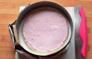 Take out the form with the base and pour coconut cream. I put a layer of strawberry-coconut jelly in the dessert, which was left for me f...