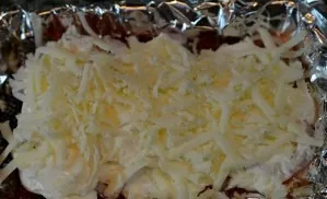 And sprinkle abundantly with grated cheese.