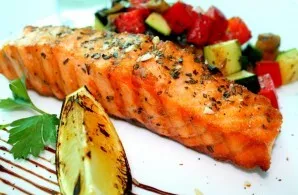 And now our dish is ready. Put salmon with vegetables and sauce on a plate, sprinkle with herbs. You can serve fresh vegetables, potatoes...