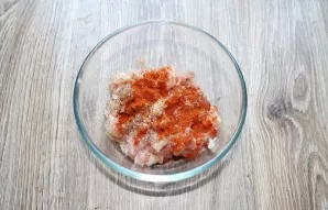 Add dry peppers to the chicken.