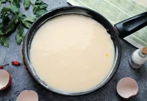 Pour the omelet mixture into the pan.