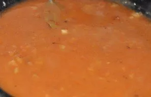 Pour a glass of hot water into the pan, mix everything and make sure that there are no lumps. Salt the sauce, add bay leaf to it and simm...