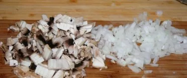 While the porridge is boiling make the sauce. Finely chop the onion and mushrooms.