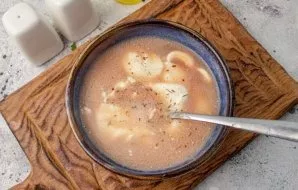 For dressing, mix sour cream, tomato paste, salt and black pepper. Add water and stir.