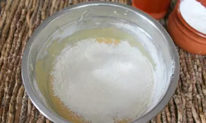 Add sifted flour and baking powder. Mix.