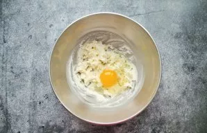 Beat the egg into the butter and beat well again.