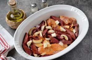 Transfer the chicken and sweet potatoes to a fireproof baking tray, put small pieces of butter on top and place in the oven, heated to 19...