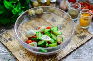 Cut quail eggs in half and put in a bowl.