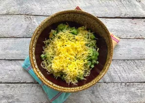 Grate the cheese on a fine grater.