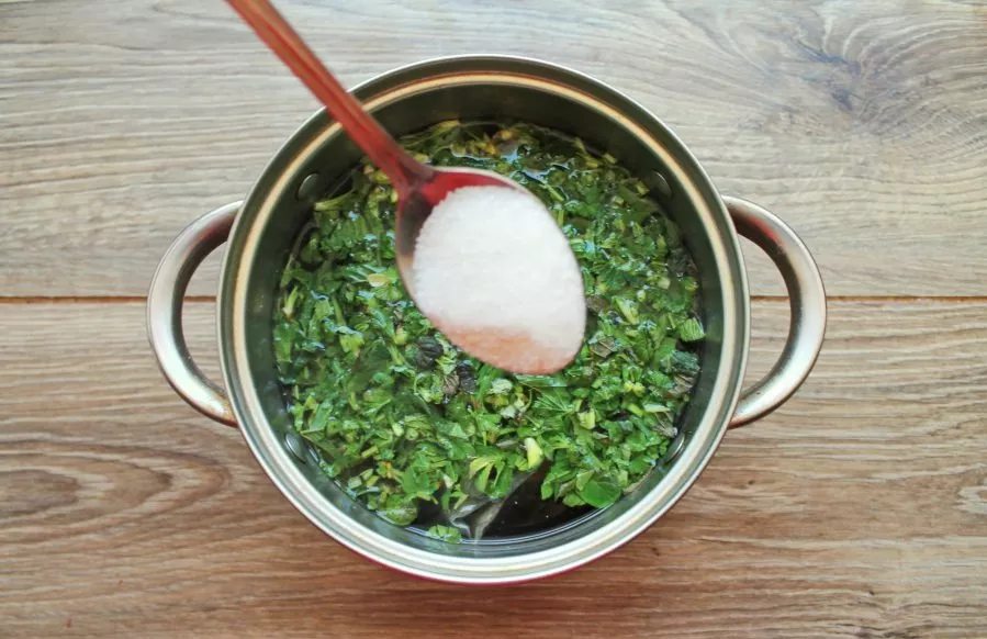 Pour sugar into the pan and stir until it dissolves.