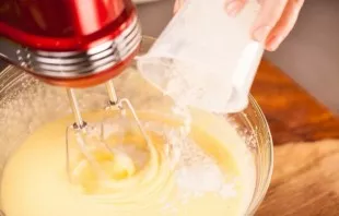 Add flour and slowly stir the dough.