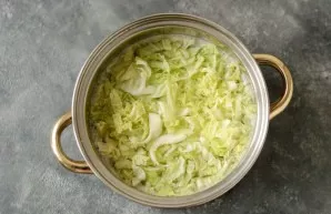 Add finely chopped savoy cabbage. Cook the soup for another 10-15 minutes over low heat.