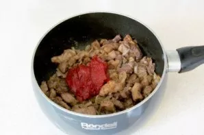 Add tomato paste, sugar and salt. Mix thoroughly again and cook for 3-4 minutes.