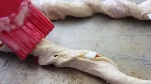 Grease with melted butter and place in the oven preheated to 200 degrees.