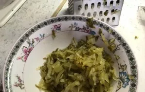 Also grate cucumbers on a coarse grater and squeeze out excess liquid. Put a layer on top of the potatoes.