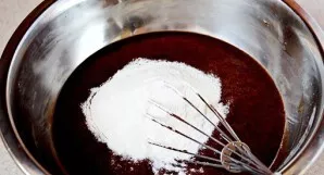 Add flour and mix everything again. The dough should be homogeneous and smooth, without lumps.