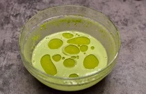 Pour the dough with a glass of boiling water and mix again. Add two tablespoons of oil to the dough and mix, let the dough rest for a few...