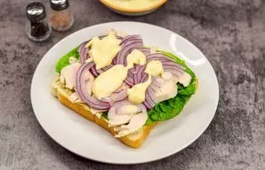 Put a red onion and a little sauce on the brisket.