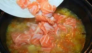 After 5 minutes, add the salmon.