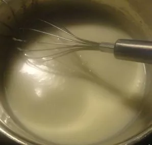 Continue to whisk and heat until the mixture has the consistency of ketchup.