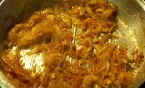 Then fry the onion in the same pan until tender. They should acquire an attractive brown tint.
