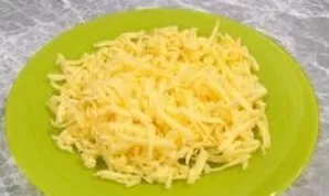 Grate the cheese on a coarse grater.