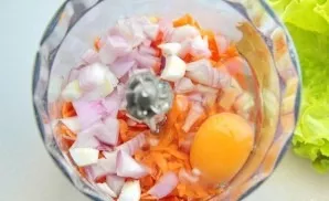 Add a grated carrot, diced onion, egg and olive oil.
