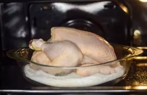 Transfer the container with the hen to a well-heated oven.