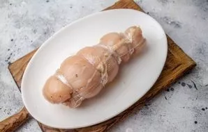 Roll the brisket into a roll. The accuracy of the form is not important, the main thing is that everything is compactly twisted. Tie it w...