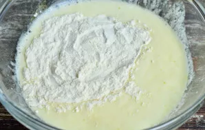 Add the sifted flour.