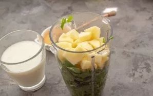 Put all the prepared products in a blender (shredder) container, pour kefir and water, add honey to taste.