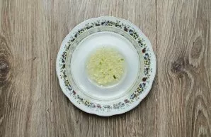 Mix vinegar, sugar, salt and vegetable oil in a bowl. Peel the garlic, chop it and add it to the mixture, stir.