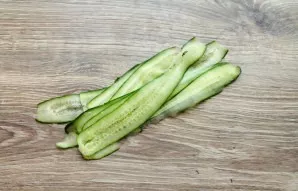 Wash the cucumber and cut lengthwise into very thin strips.