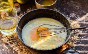 Then put one egg yolk in the pan.
