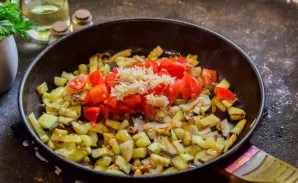 Add diced tomatoes and chopped garlic to the pan. Fry everything together for a few minutes.