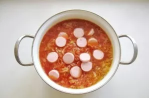 Cook borscht until all vegetables are completely cooked. Then chop the sausages and add them to the soup. Boil for 5 minutes, remove the ...