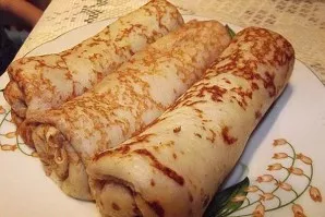 Roll up the pancakes and put them in one container. Before eating, they can be easily fried on both sides in butter or simply heated in t...