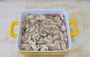 Put the baked mushrooms on top of the meat.
