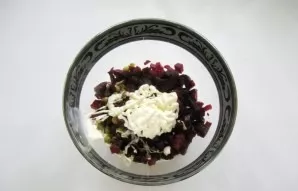 Season the salad with mayonnaise.