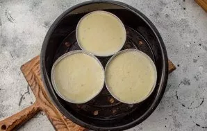 Smear the forms with vegetable oil and pour zucchini mass into them. Do not be afraid that the mass will be liquid, in the process they w...