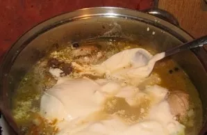 Then pour in sour cream and simmer over low heat until tender.