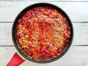 Pour buckwheat with vegetables with hot water, salt, add spices and simmer over medium heat until tender.