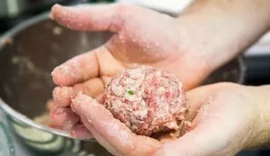 Form meatballs the size of tennis balls.