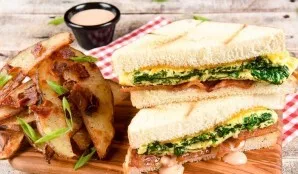 Cover the toast with a second piece of bread. Serve sandwiches with potatoes. Have a delicious breakfast!