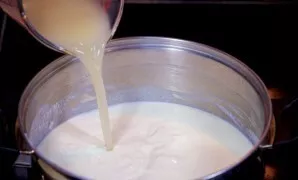 Pour the chicken broth into the cream mixture and simmer for 10 minutes.