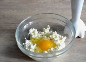 While the dough is in the refrigerator, prepare the cottage cheese filling. Use a blender to blend the cottage cheese together with the e...
