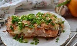 Place the fish for 15 minutes in an oven preheated at 200  C, and then 2-3 minutes under the grill until browned.