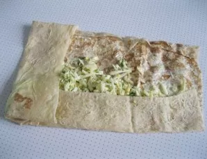 Add the filling and gently roll up the lavash patty.