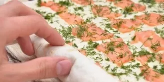 I roll it into a dense roll, then it will be more convenient to cut. I wrap the lavash in cling film and put it in the refrigerator for 1...