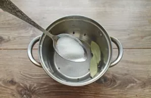 Pour sugar into a saucepan.